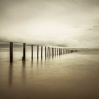 Poles at the beach with soft vintage toning