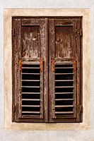 Characteristic window with closed wooden shutters