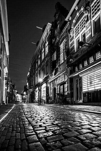 Warmoestraat in downtown Haarlem - black and white by Arjen Schippers