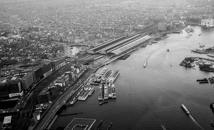 Amsterdam Central station above the IJ by Melvin Erné