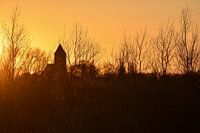 Sunset, church tower Zalk along the IJssel river