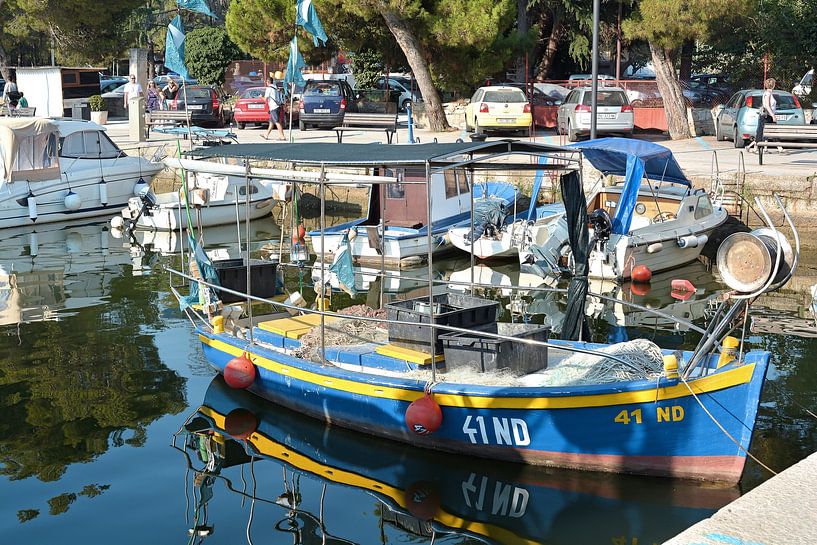 Fishing boats in the port of Novigrad on the coast of the Adriatic Sea in Croatia by Heiko Kueverling