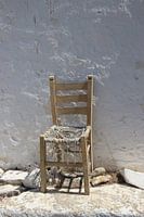 Old chair against white wall
