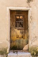 Old weathered door in shades of brown in Buis de Baronie in France