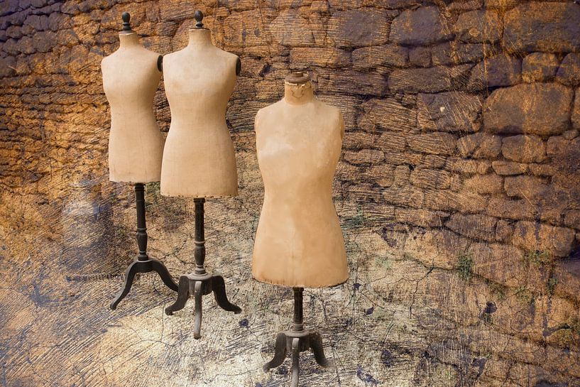 Old mannequins against an old wall in France by Birgitte Bergman