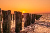 Sunset Domburg with wave breakers