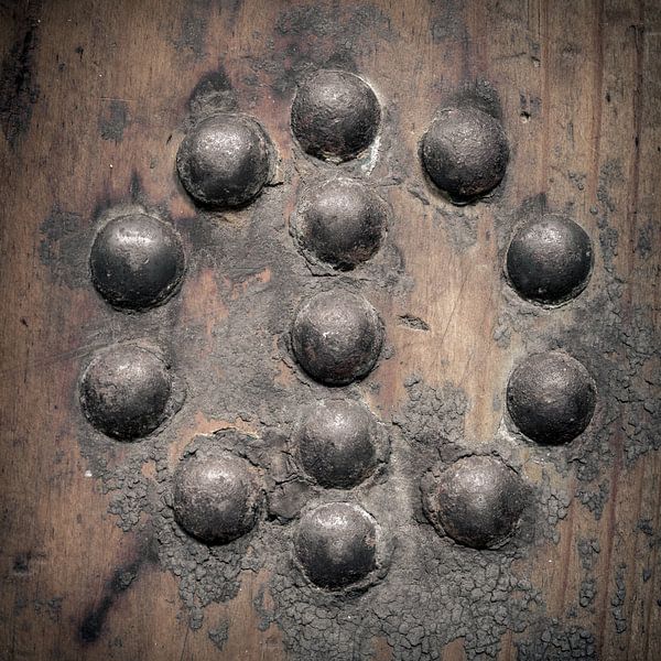 nails in wooden board (round) by Danny den Breejen