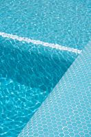 Blue mosaic pool with lines through depths
