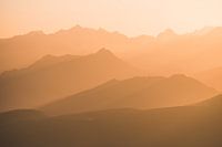 Layered mountain landscape at sunset