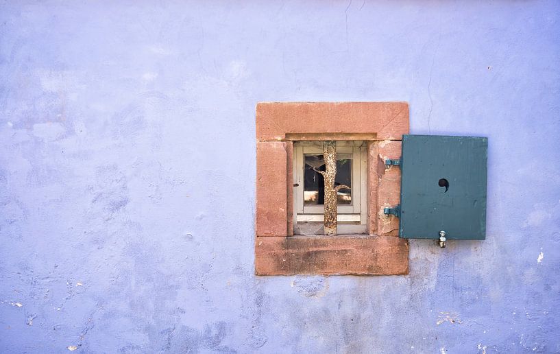 Minimalist photo of an old purple-blue façade with frame in France by Birgitte Bergman