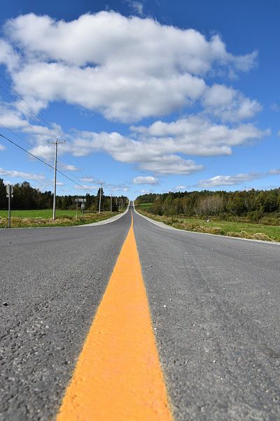 A country road under a blue sky by Claude Laprise