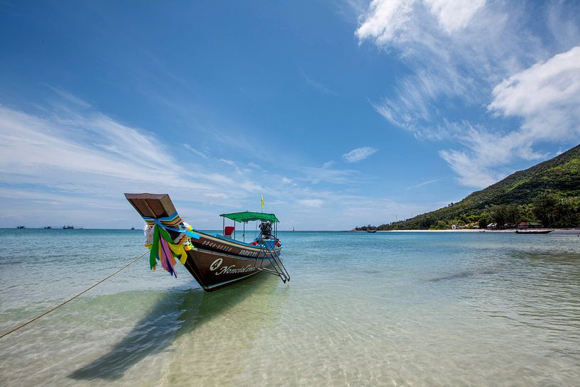 Tropical holiday. longtail boat on a tropical beach in thailand by Tjeerd Kruse