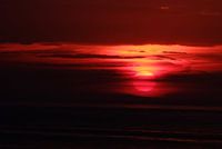 Zonsondergang aan zee