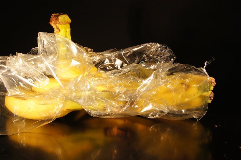 bananas with plastic packaging by Marion Hesseling