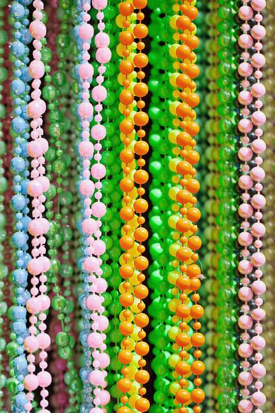 Close-up of cheerful multicolored bead strings by Tony Vingerhoets