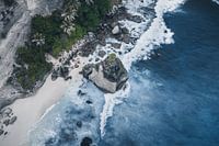 Tropical coastline with rock formation and surf