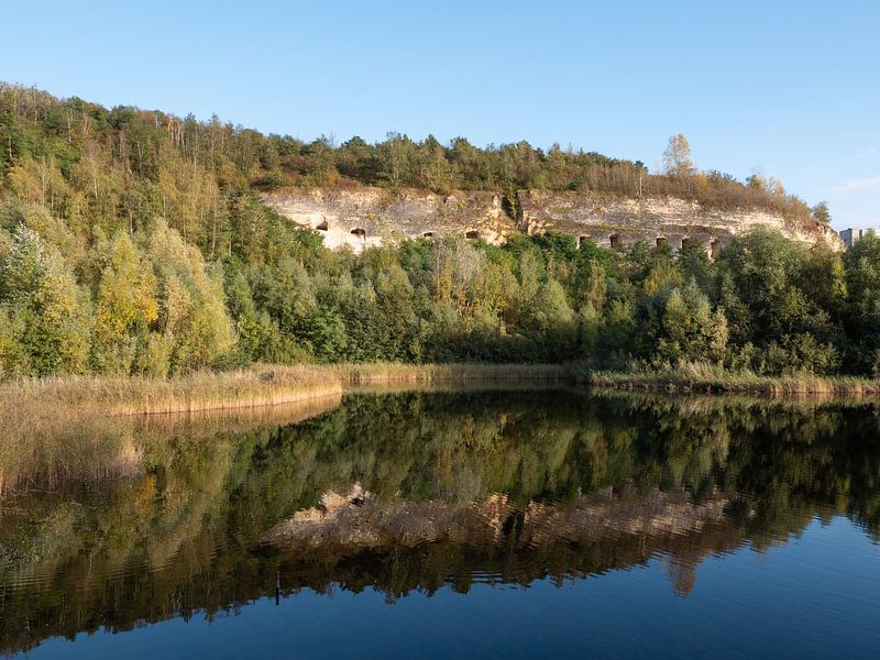 Lake with water reflections at former Enci limestone quarry in Limburg by Robin Jongerden