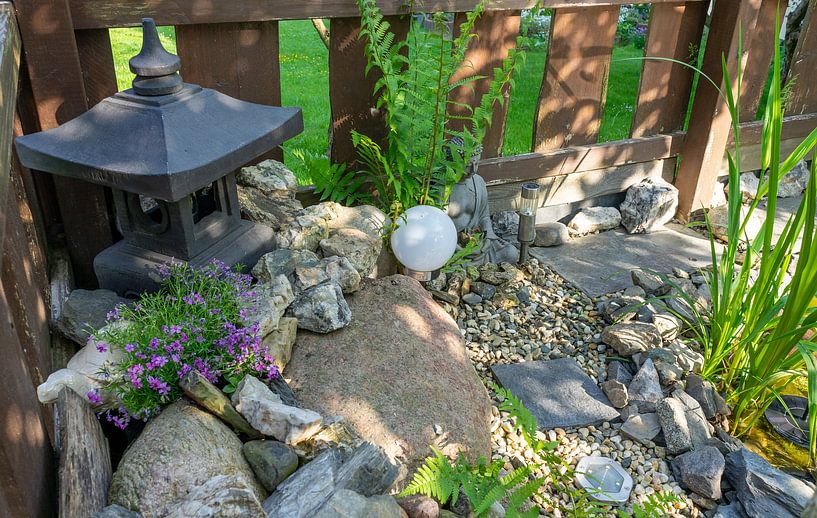 Japanese garden with temple and stones by Animaflora PicsStock