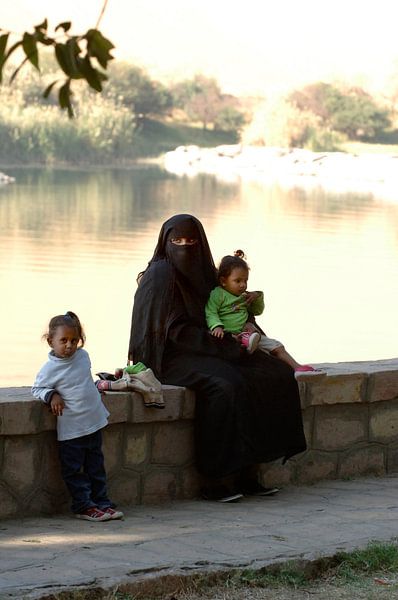 Veiled woman with children by Lein Kaland