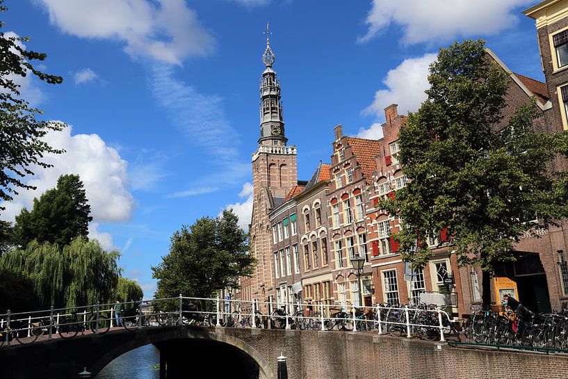 Church and other historical buildings on a canal in Leiden, The Netherlands by Jan Kranendonk