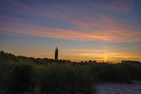 Leuchtturm von Texel mit Sonnensäule bei Sonnenaufgang