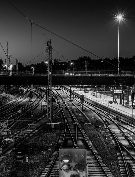 Black and white rails at night by Anna Davis