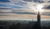 Winter view over foggy Hilversum with silhouette of church