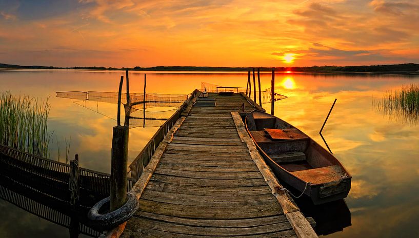 Boat at the jetty at sunset by Frank Herrmann