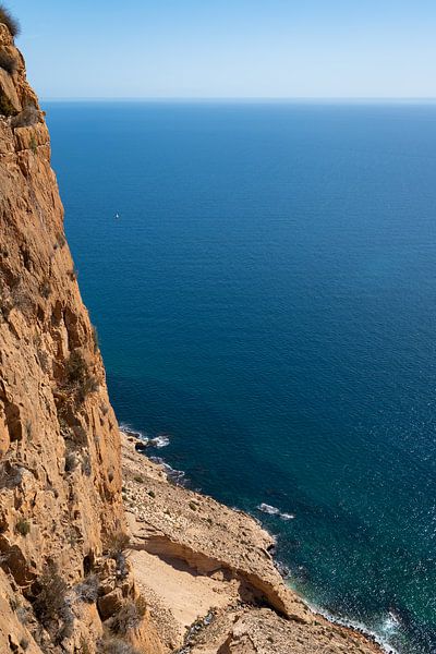 Rugged cliff and view of the blue sea by Adriana Mueller