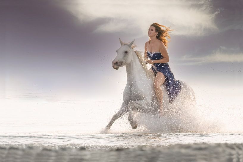 Girl on horseback through the surf by Laura Loeve