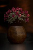 Roses in copper hammered vase