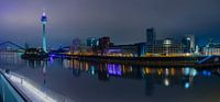 Panorama of the Düsseldorf skyline in the evening with the Rhine Tower.