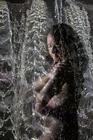 woman under waterfall