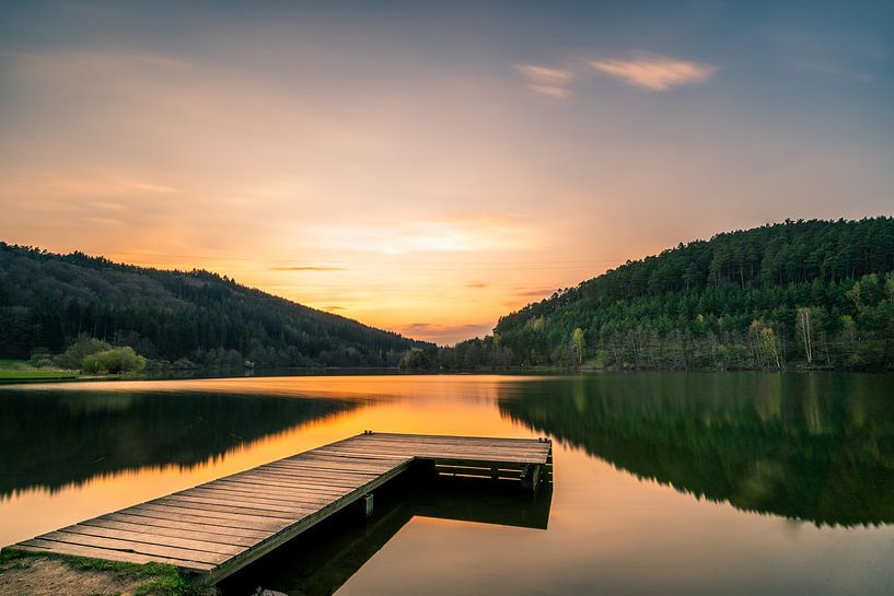 jetty at the reservoir in the evening hours by Christian Klös