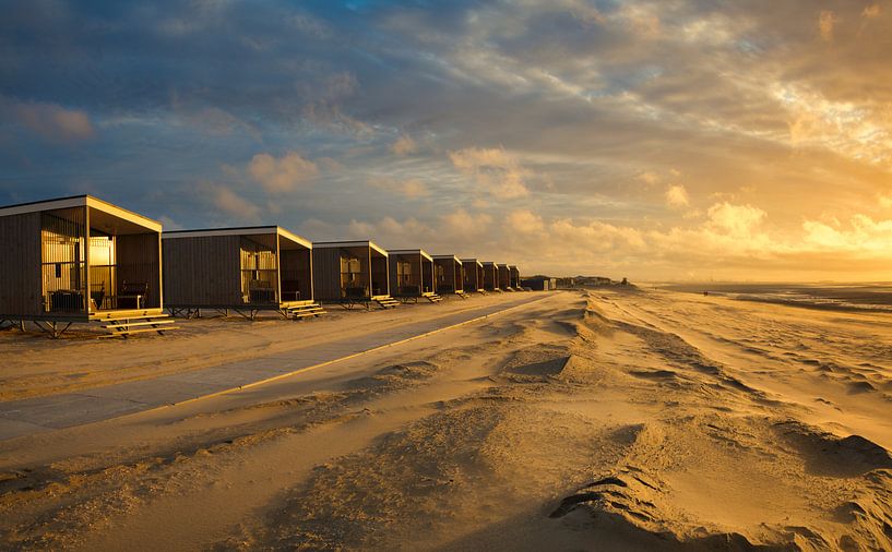 Beach cottages on the coast at sunset by iPics Photography